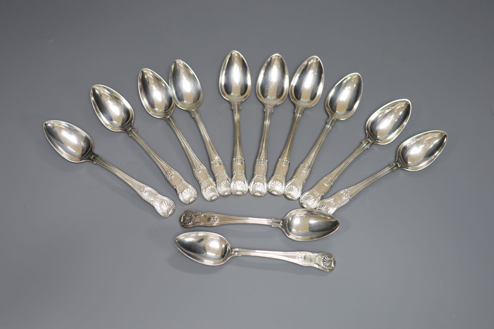 A matched set of twelve George III silver hourglass pattern teaspoons, various makers, London, 1817/8, 11oz.